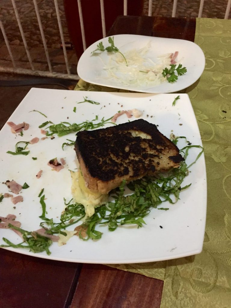 a burned bruschetta on a plate