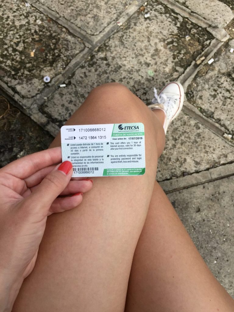 a person holding an internet card in cuba to show How to get internet in Cuba